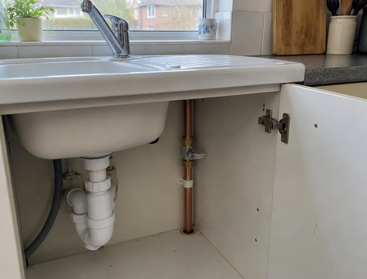 Kitchen tap, sink and copper water supply pipework
